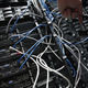 A worker connects IBM Intelligent Cluster modules, including servers and data storage devices, of a Data Center at the IBM.